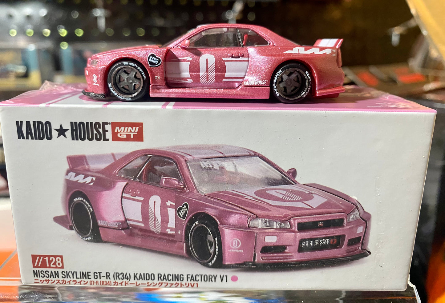 Kaido House x Mini GT 1:64 Nissan Skyline GT-R (R34) Kaido Racing Factory V1 – Pink